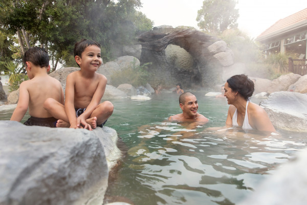 A family bathing in geothermal hot pools, Rotorua